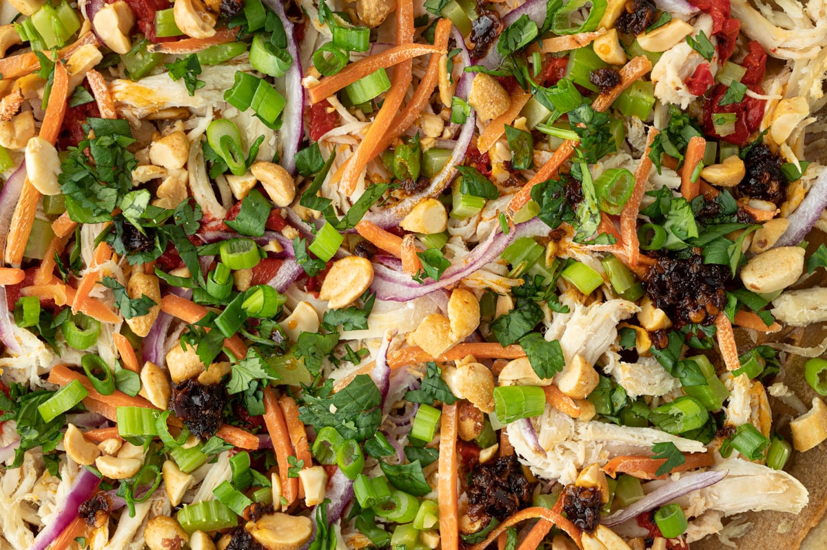 close up overhead shot of veggies on pizza