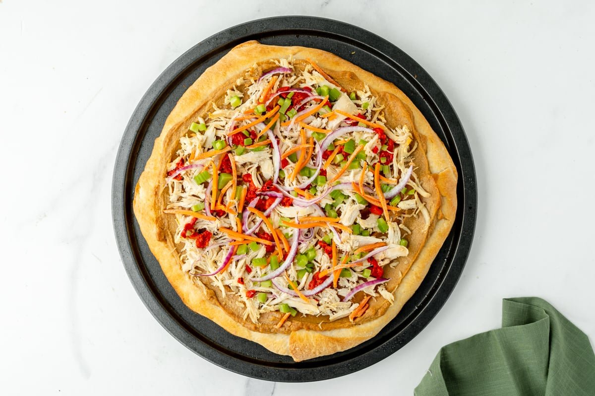 toppings added to pizza crust