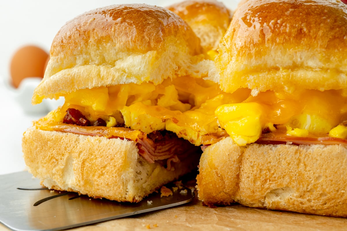straight on shot of one breakfast slider pulling apart from others