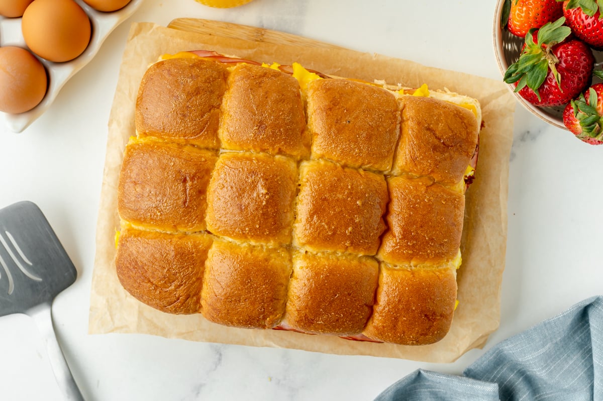 overhead shot of breakfast sliders on parchment paper