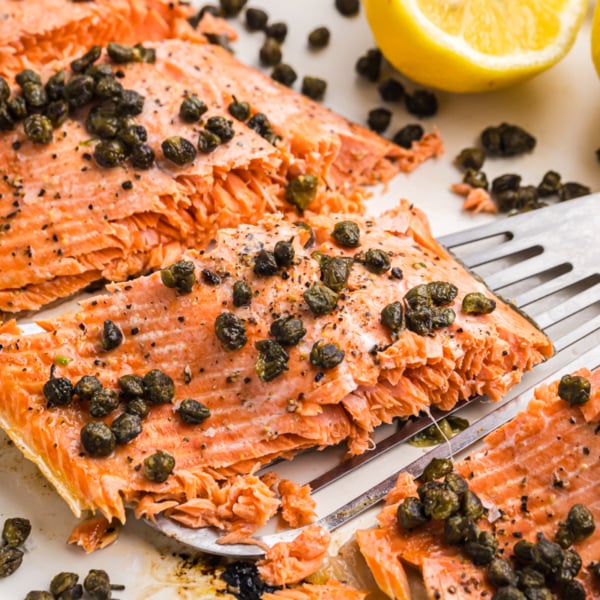 angled shot of piece of lemon salmon on spatula