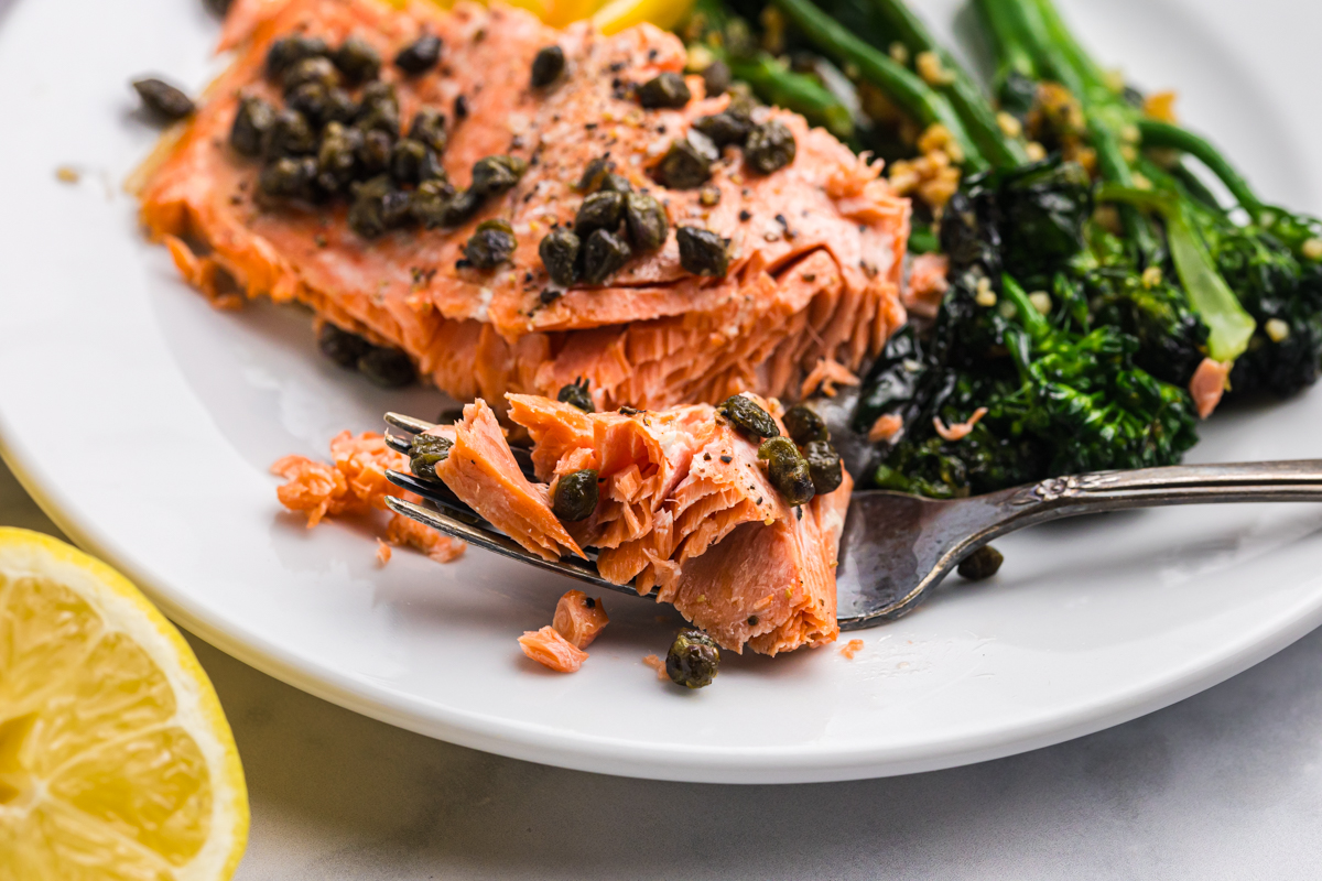 close up of bite of lemon salmon on fork