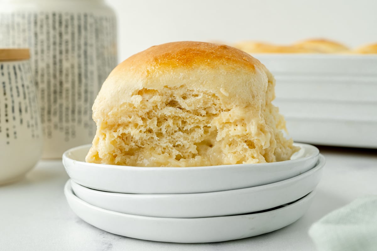 straight on shot of pani popo on stack of plates