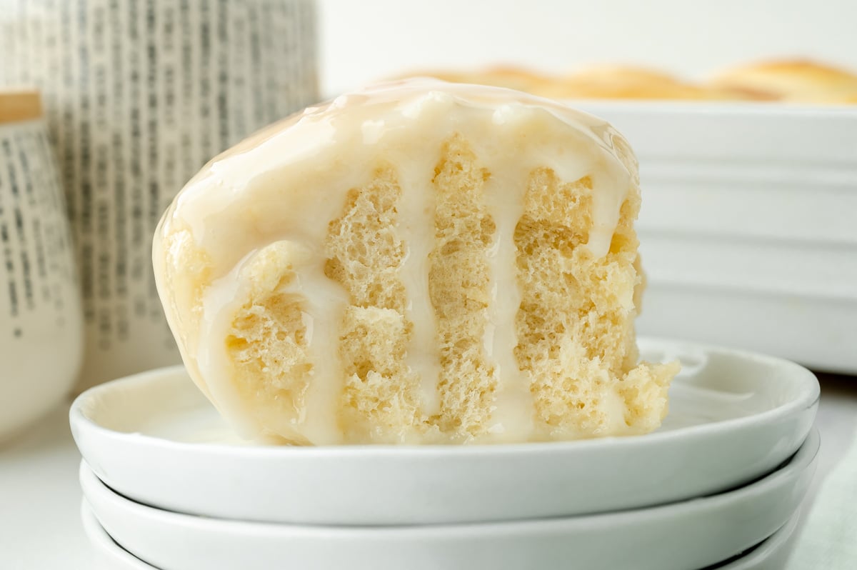 straight on shot of coconut sauce dripping down pani popo roll