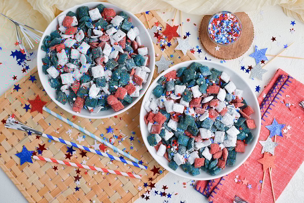 overhead shot of two bowls of red white and blue puppy chow