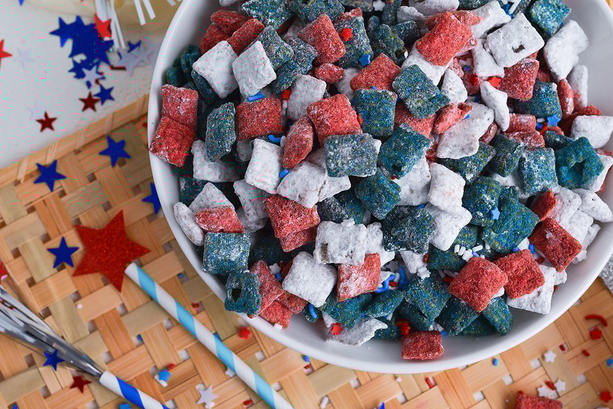 close up overhead shot of bowl of red white and blue muddy buddies
