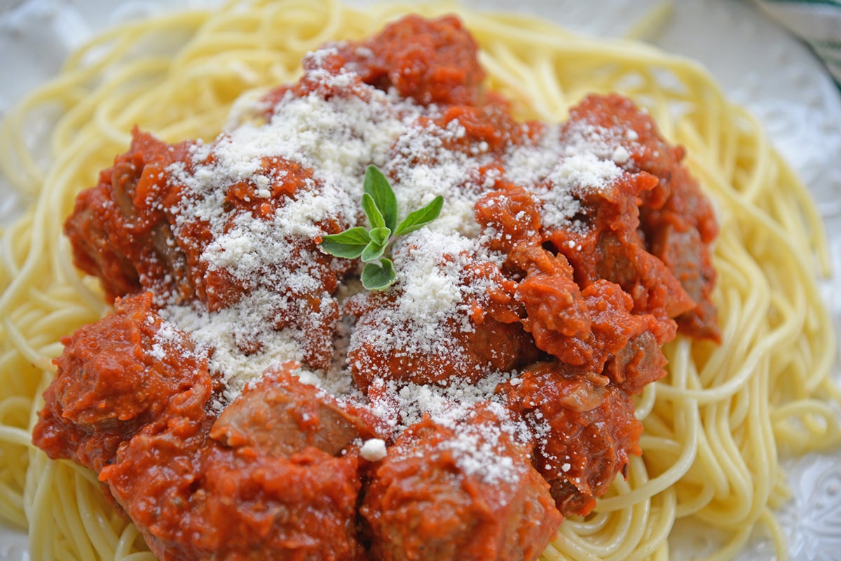 close up angled shot of plate of homemade spaghetti and meatballs