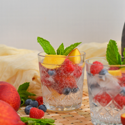 straight on shot of two glasses of sparkling peach sangria