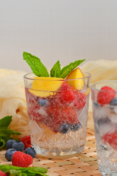 straight on shot of two glasses of sparkling peach sangria