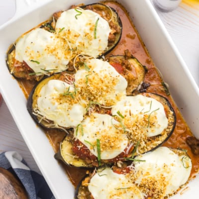 overhead shot of stuffed eggplant in baking dish