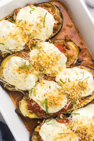 overhead shot of stuffed eggplant in baking dish