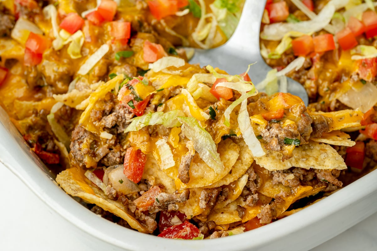 close up angled shot of serving spoon in taco bake casserole
