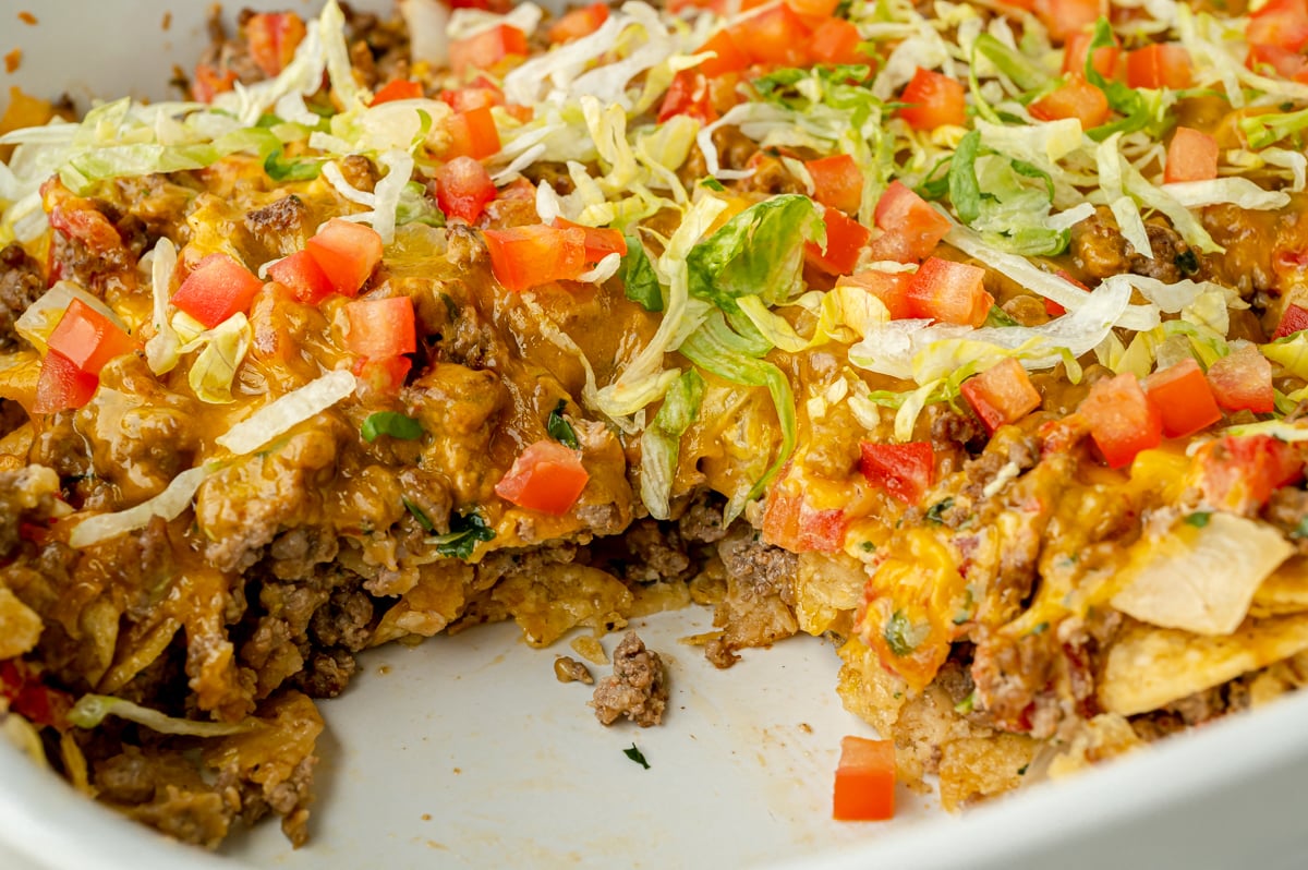 close up angled shot of scoop taken out of taco bake casserole