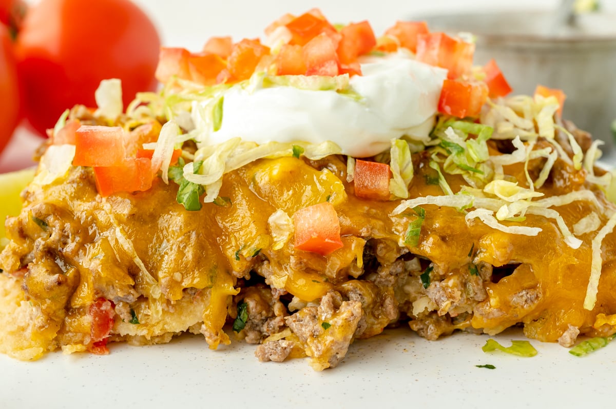 close up straight on shot of slice of taco bake casserole