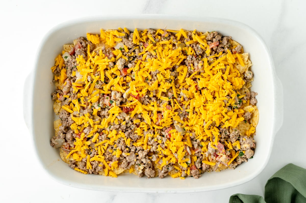 overhead shot of taco bake casserole ingredients in baking pan