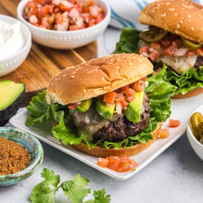 angled shot of taco burgers on a platter