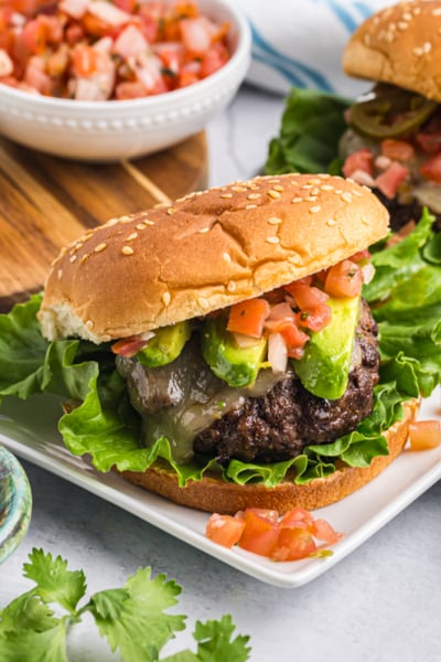 angled shot of taco burgers on a platter