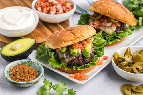 angled shot of taco burgers on a platter