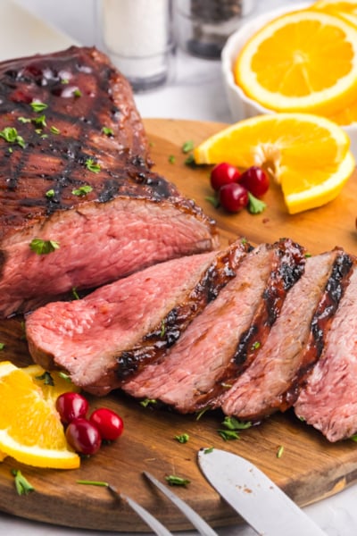 sliced tri-tip roast on board