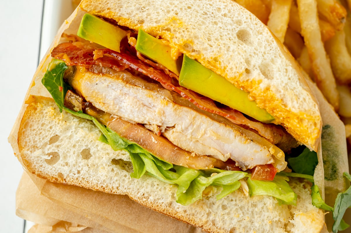overhead shot of chicken sandwich cut in half
