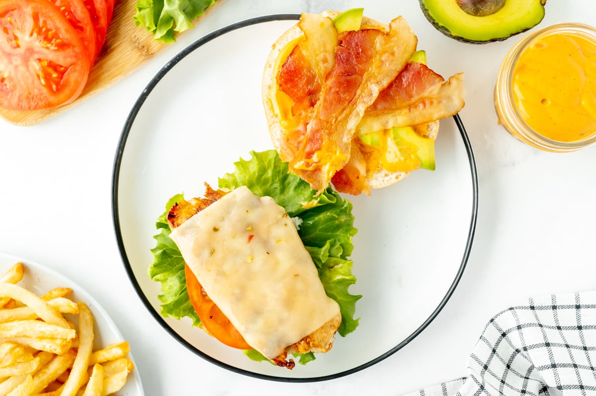 overhead shot of open face spicy chicken sandwich on plate