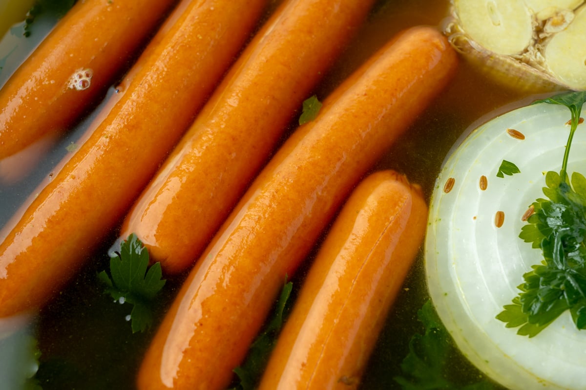 close up shot of how to boil hot dogs