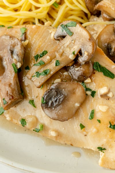 close up overhead shot of chicken marsala on plate