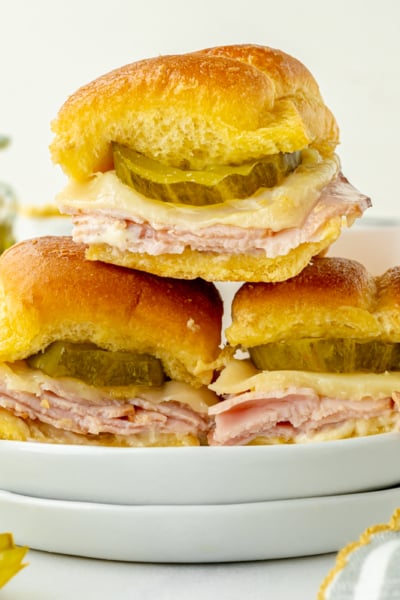 straight on shot of stack of three sliders on plate