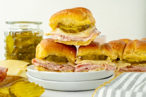 straight on shot of stack of three sliders on plate