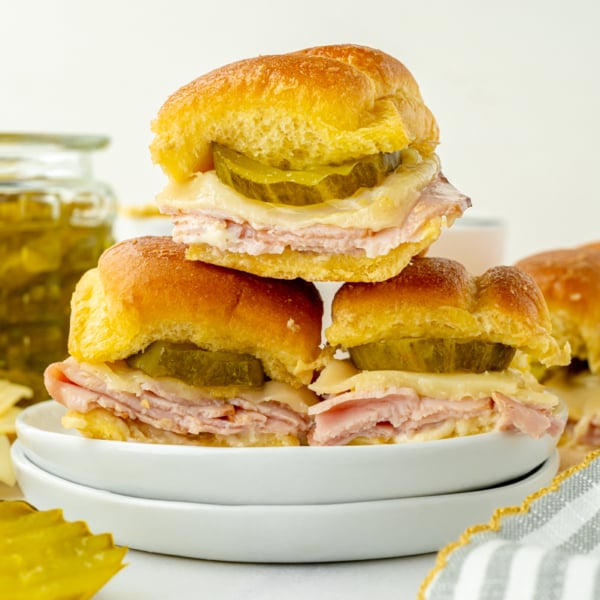 straight on shot of stack of three sliders on plate