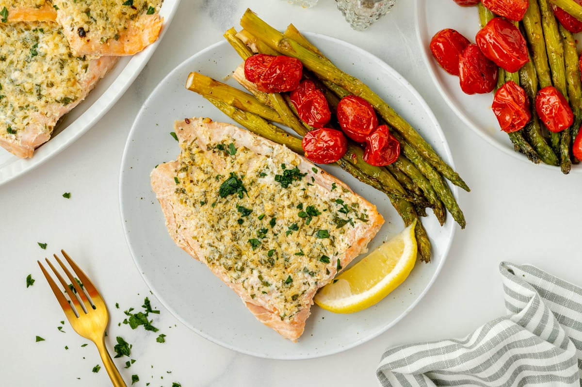 overhead shot of garlic butter salmon on plate with green beans