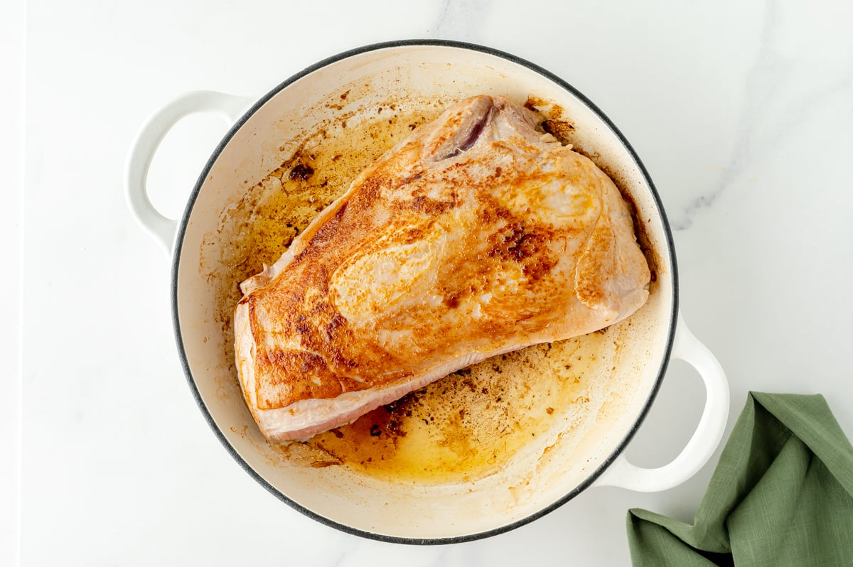 pork loin browning in a skillet 