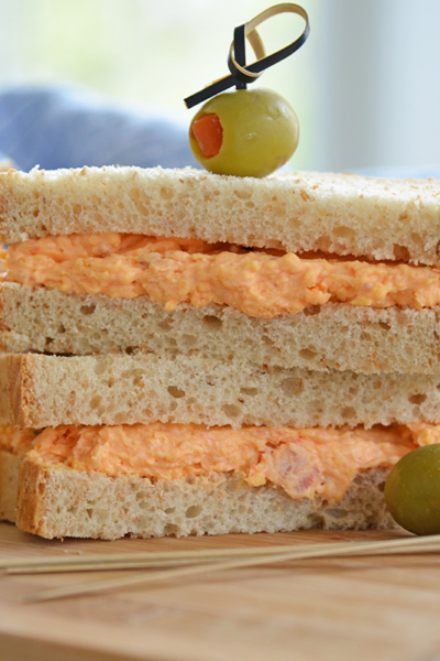 pimento cheese sandwich on wheat bread with olives