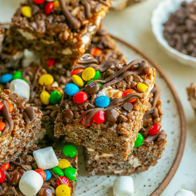 angled shot of plate of chocolate rice krispie treats