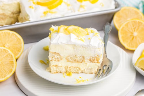 slice of lemon tiramisu on plate with fork
