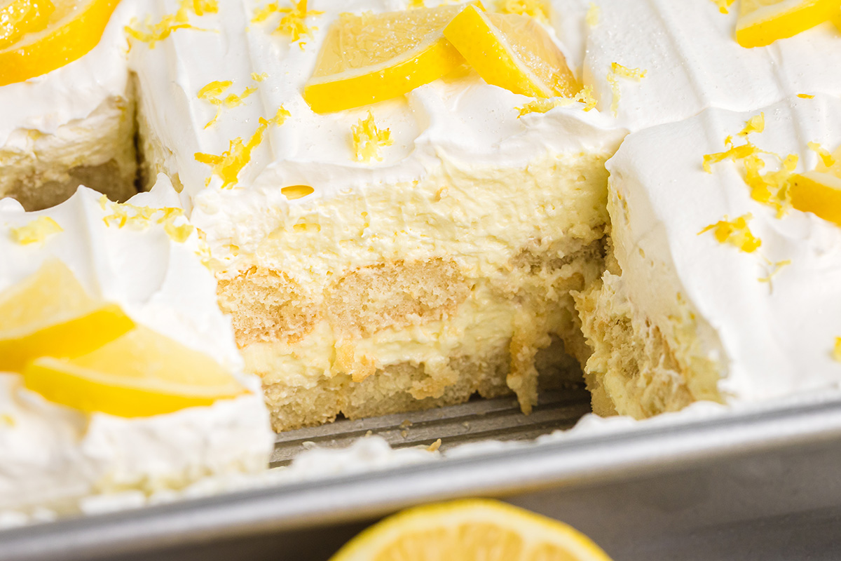slice taken out of pan of lemon tiramisu