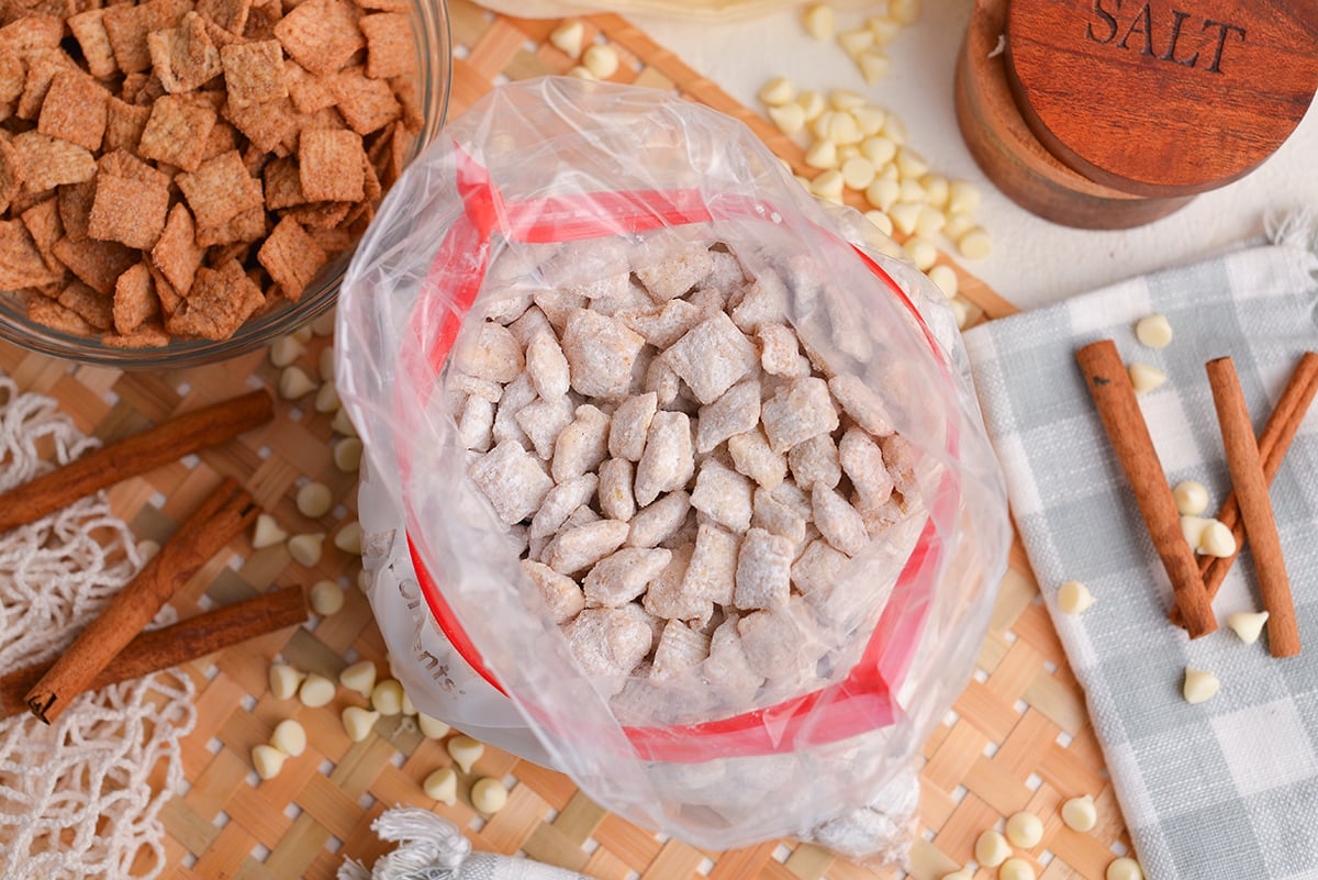 overhead shot of snickerdoodle puppy chow in ziplock bag