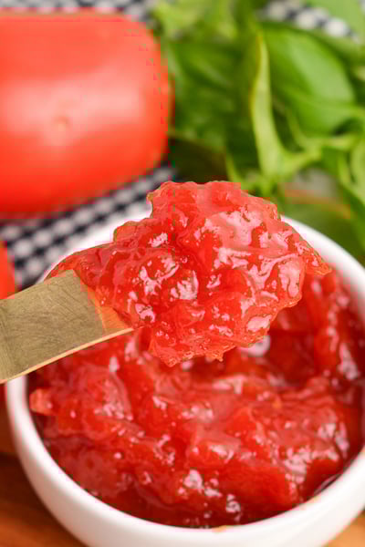 tomato jam on small knife