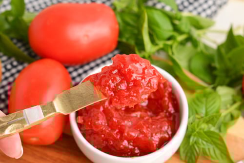 tomato jam on small knife