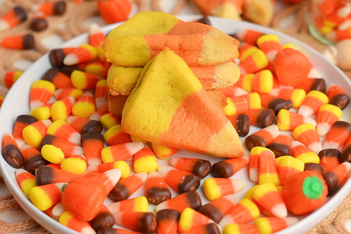 stack of cookies on plate of candy corn