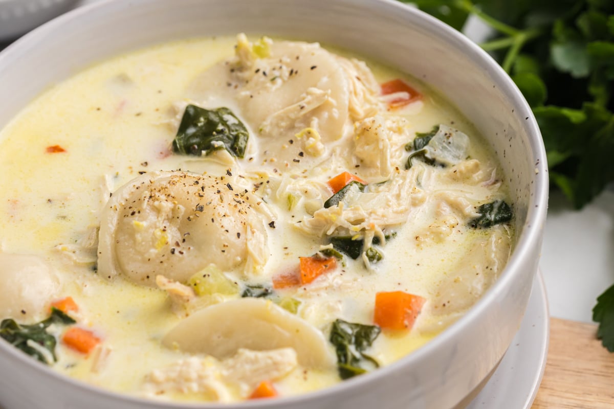 close up angled shot of bowl of chicken florentine soup