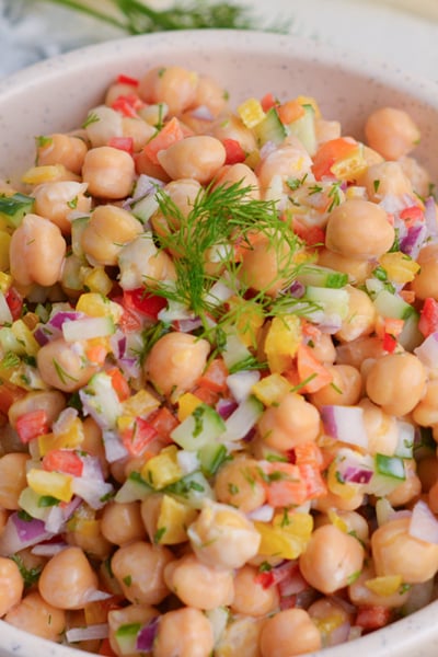 angled shot of bowl of chickpea salad