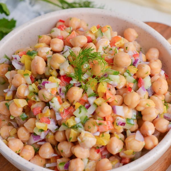 angled shot of bowl of chickpea salad