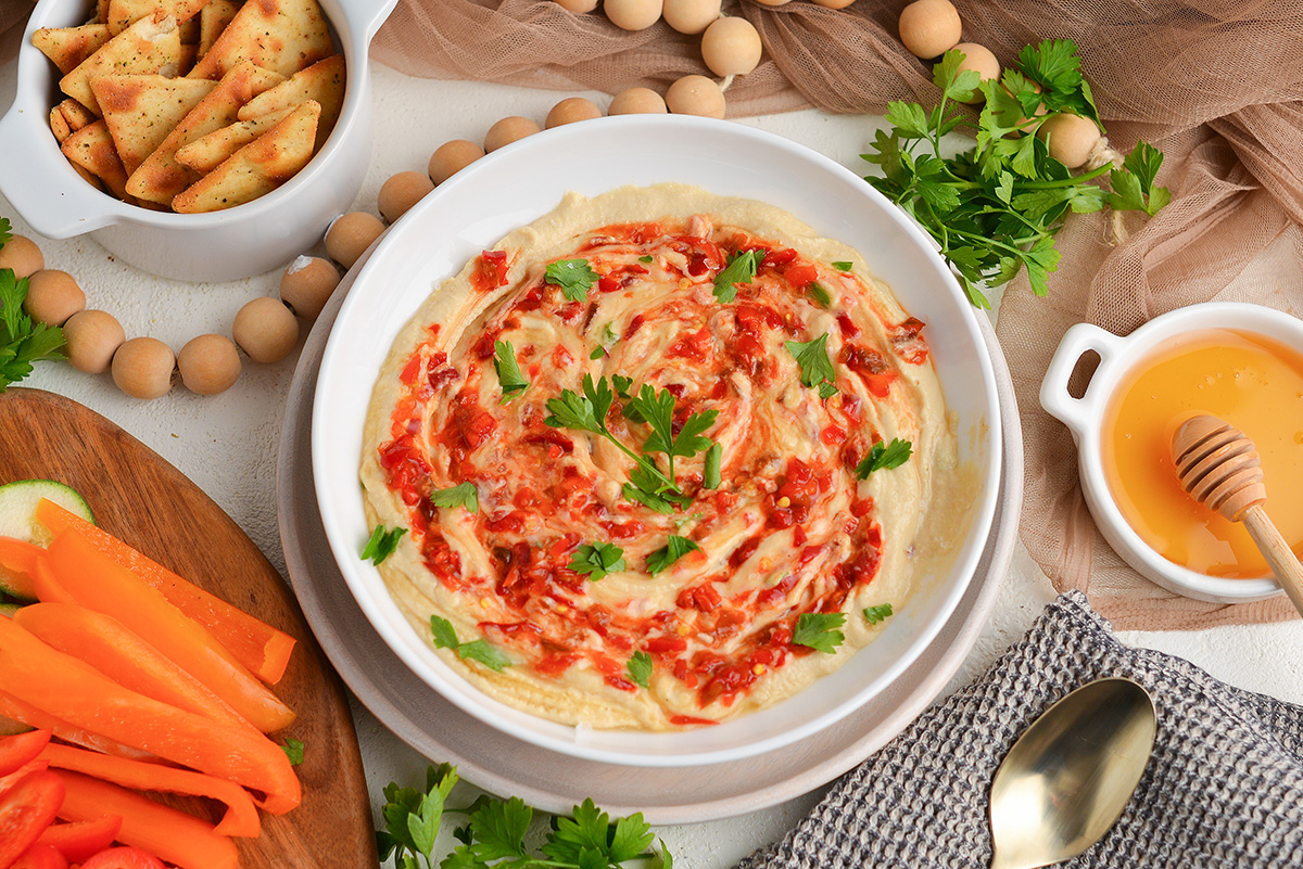 overhead shot of bowl of hot honey hummus