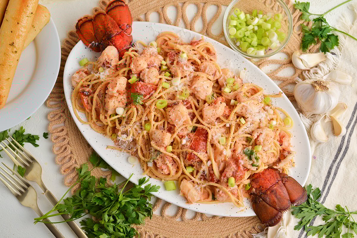 overhead shot of platter of lobster cream sauce pasta