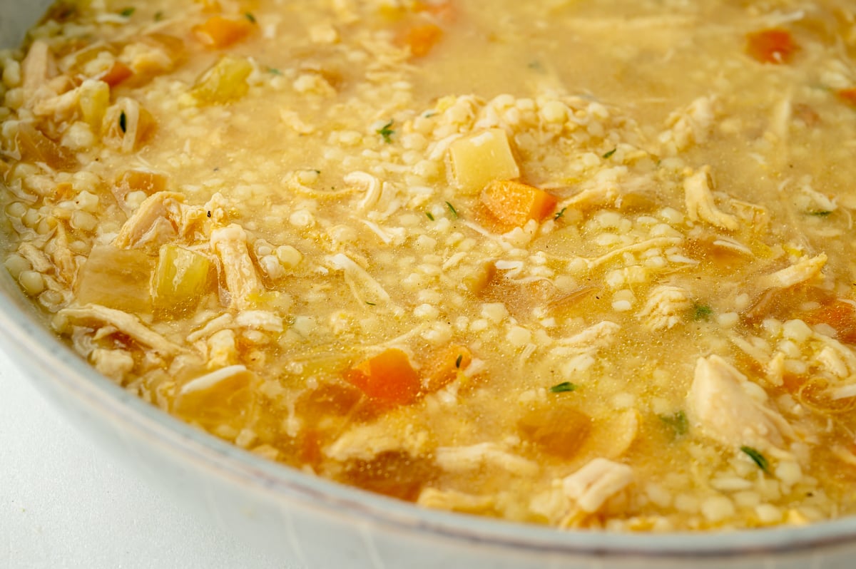 close up angled shot of bowl of pastina soup