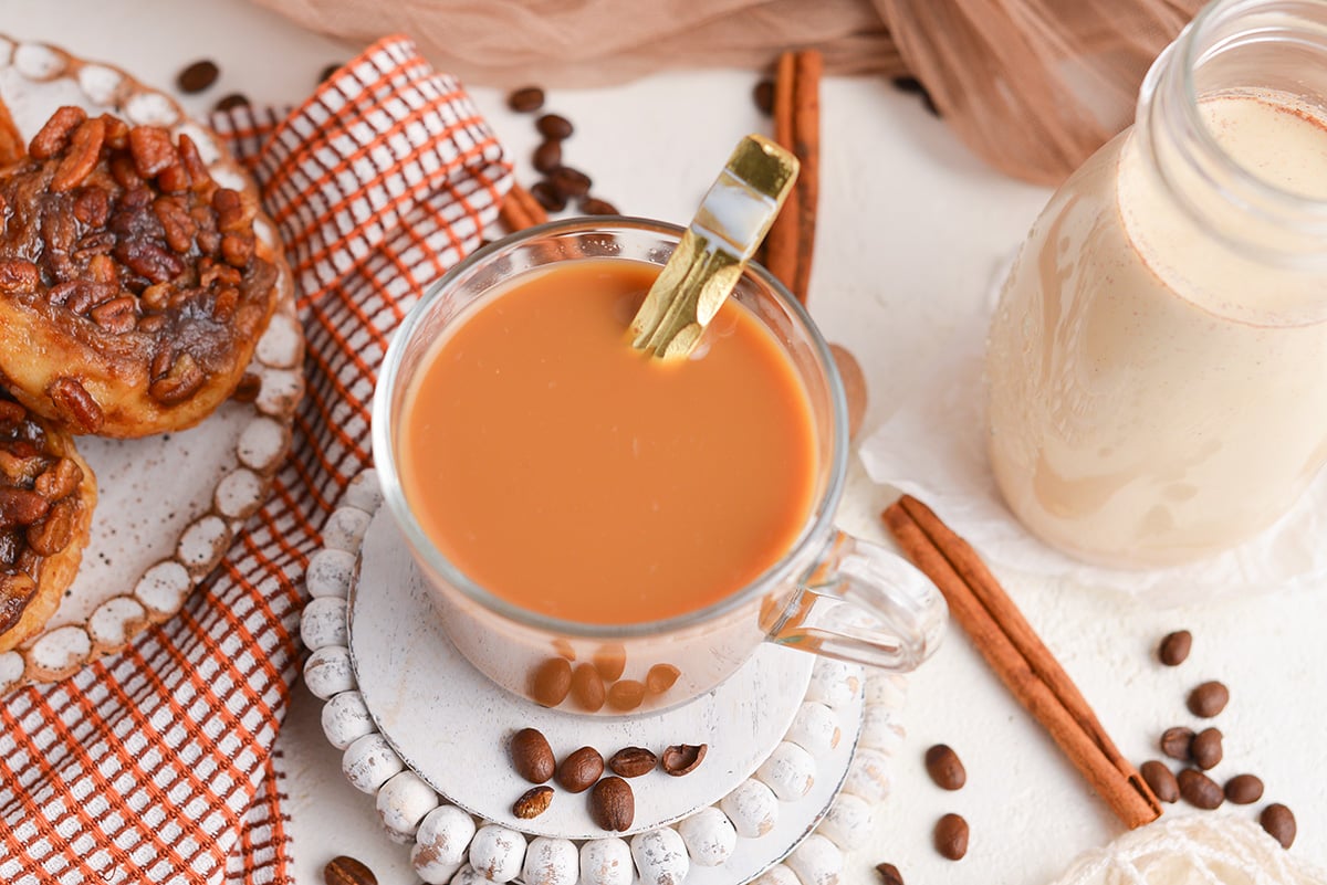 overhead shot of cup of coffee with pumpkin spice creamer