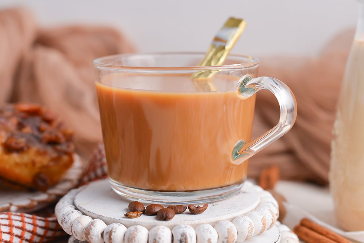 straight on shot of cup of coffee with cream