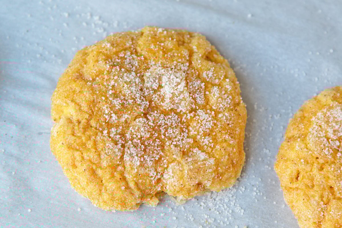 close up of pumpkin drop cookie on parchment paper