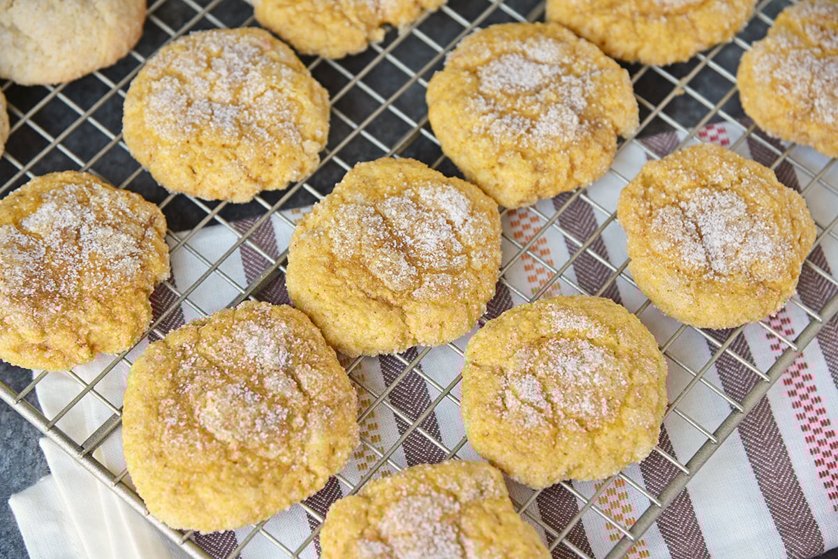 angled shot of pumpkin drop cookies on cooling rack